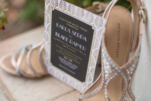 Wedding details including shoes and invitation captured by top Orlando wedding photographer