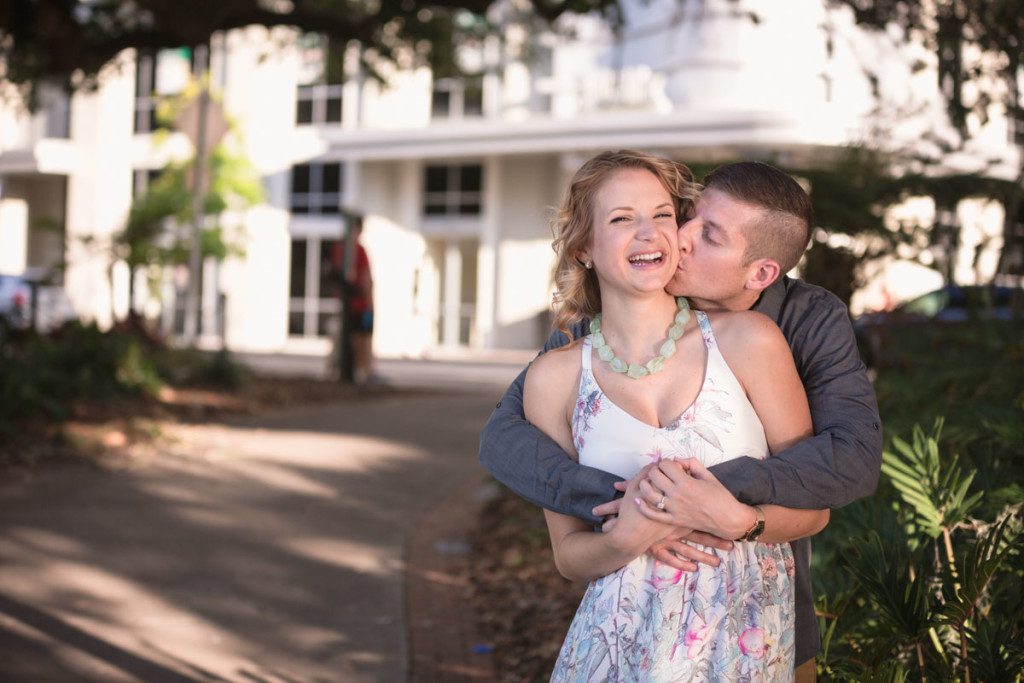 Surprise marriage proposal and engagement session at Lake Eola in Downtown Orlando by top wedding photographer