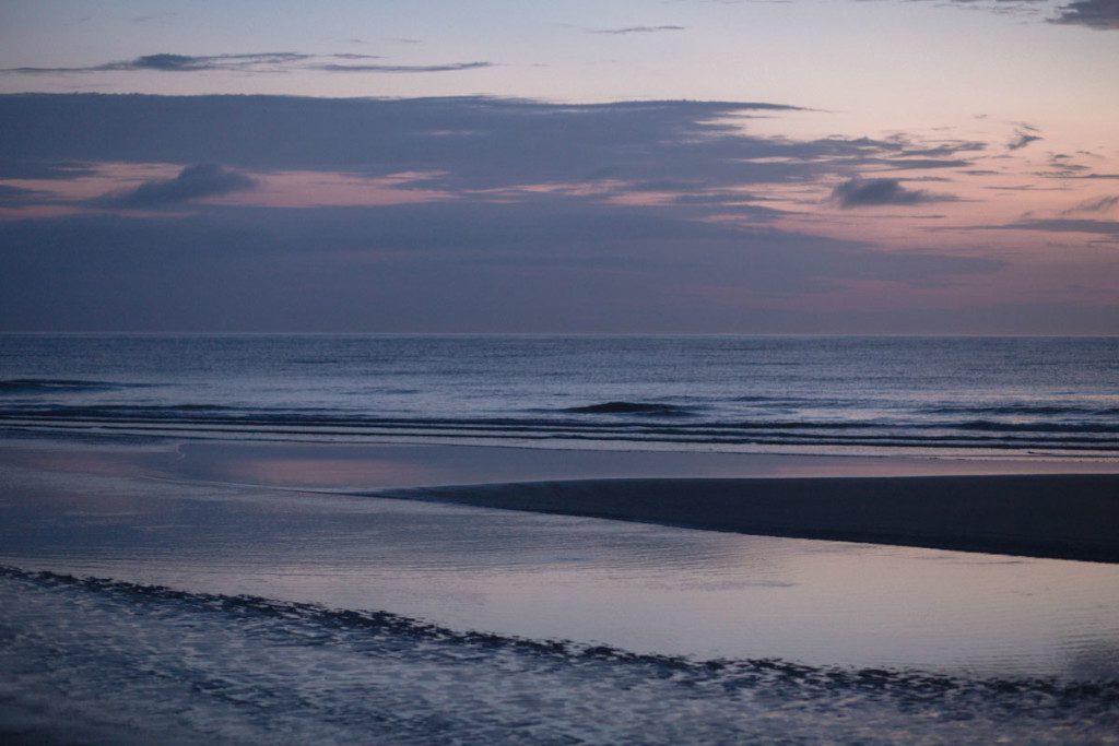 Surprise sunrise proposal at New Smyrna Beach by top Orlando photographer