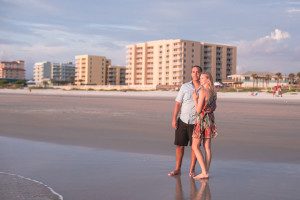 Surprise proposal and engagement at sunrise at New Smryna beach by top Orlando wedding photographer