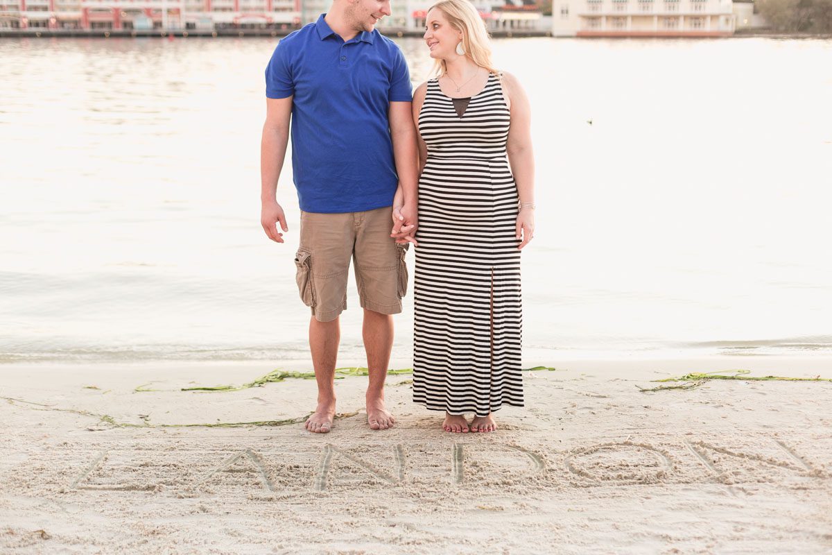 Top Orlando wedding photographer captures maternity portraits for expectant couple at Disney's Boardwalk and Beach club resort in Orlando