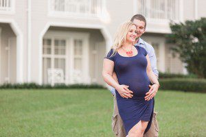 Top Orlando wedding photographer captures maternity portraits for expectant couple at Disney's Boardwalk and Beach club resort in Orlando