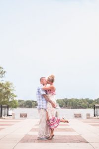 Surprise Orlando proposal photography at Lake Eola park with two kids captured by top Orlando wedding and engagement photographer