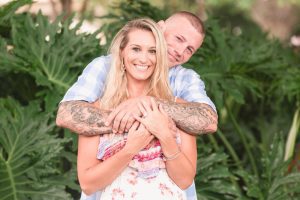 Surprise Orlando proposal photography at Lake Eola park with two kids captured by top Orlando wedding and engagement photographer