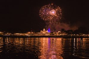 Surprise Orlando proposal photography at Disney's grand floridan under the fireworks captured by top Orlando wedding and engagement photographer