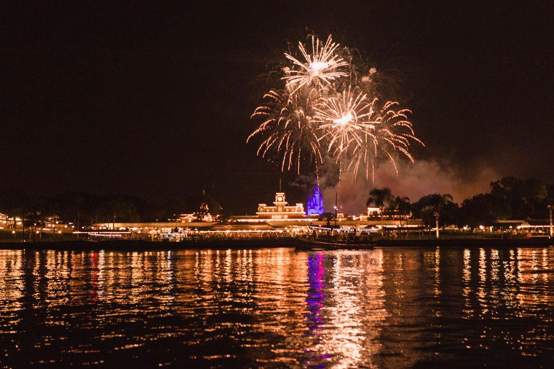 Surprise Orlando proposal photography at Disney's grand floridan under the fireworks captured by top Orlando wedding and engagement photographer