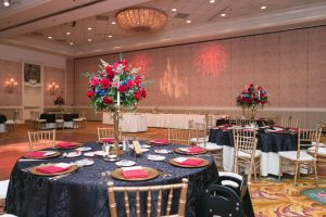 Romantic Disney wedding photography in Orlando featuring a red beauty and the best theme captured by top Orlando wedding photographer and videographer