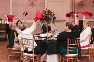 Romantic Disney wedding photography in Orlando featuring a red beauty and the best theme captured by top Orlando wedding photographer and videographer