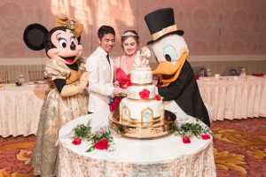 Top Orlando wedding photographer and videographer capture fun themed wedding at Disney's wedding pavilion at the grand floridan in Orlando