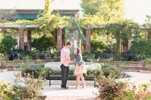 Surprise proposal photography at a rose garden in Winter Park by top Orlando wedding and engagement photographer