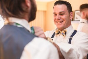 Orlando wedding photographer captures Groom and groomsmen getting ready for Veranda at Thornton park wedding downtown