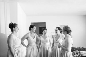 Bridesmaids in champagne and blush dresses get ready for Veranda at Thornton park wedding by Orlando wedding photographer and videographer
