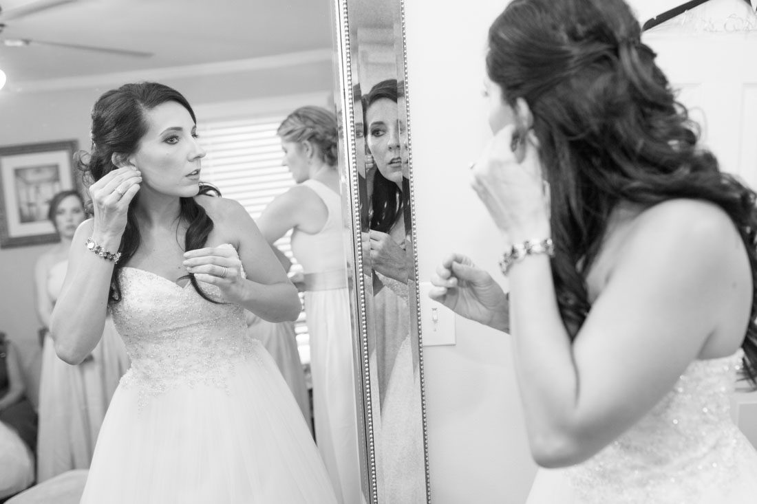 Orlando wedding photography and videography team capture bride getting ready for Veranda at Thornton park wedding in downtown