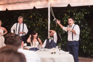 Orlando wedding photographer and videographer capture fun nighttime reception under a tent at the Veranda at Thornton Park