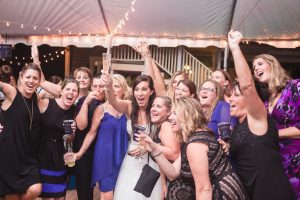 Orlando wedding photographer and videographer capture fun nighttime reception under a tent at the Veranda at Thornton Park