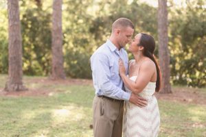 Sunny Fall engagement photography session in downtown Orlando park featuring their dogs