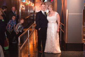 Newlywed couple rides Epcot's Soarin ride during their wedding reception captured by top Disney wedding photographer