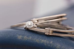 Close up of the engagement ring on police handcuffs during engagement photography session