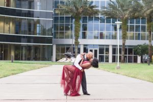 A fun dip in front of the buildings at the University of Central Florida engagement session