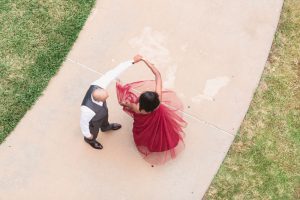 Couple dances during their engagement photo shoot at UCF