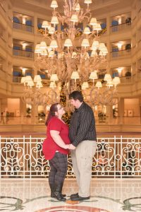Photo in the lobby of the Grand Floridian hotel for anniversary portraits by top Orlando wedding photographer