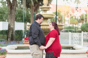 Couple celebrates their wedding anniversary with engagement style portrait photography at Disney's grand floridian resort in Orlando