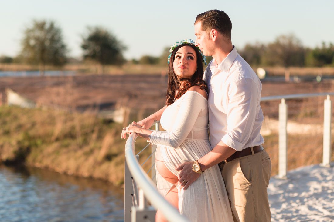 Maternity portrait on the lake taken at sunset in Lake Nona by top Orlando maternity photographer