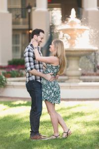 Romantic engagement photo in front of a glowing fountain at Disney Port Orleans Riverside resort captured by top Orlando photographer
