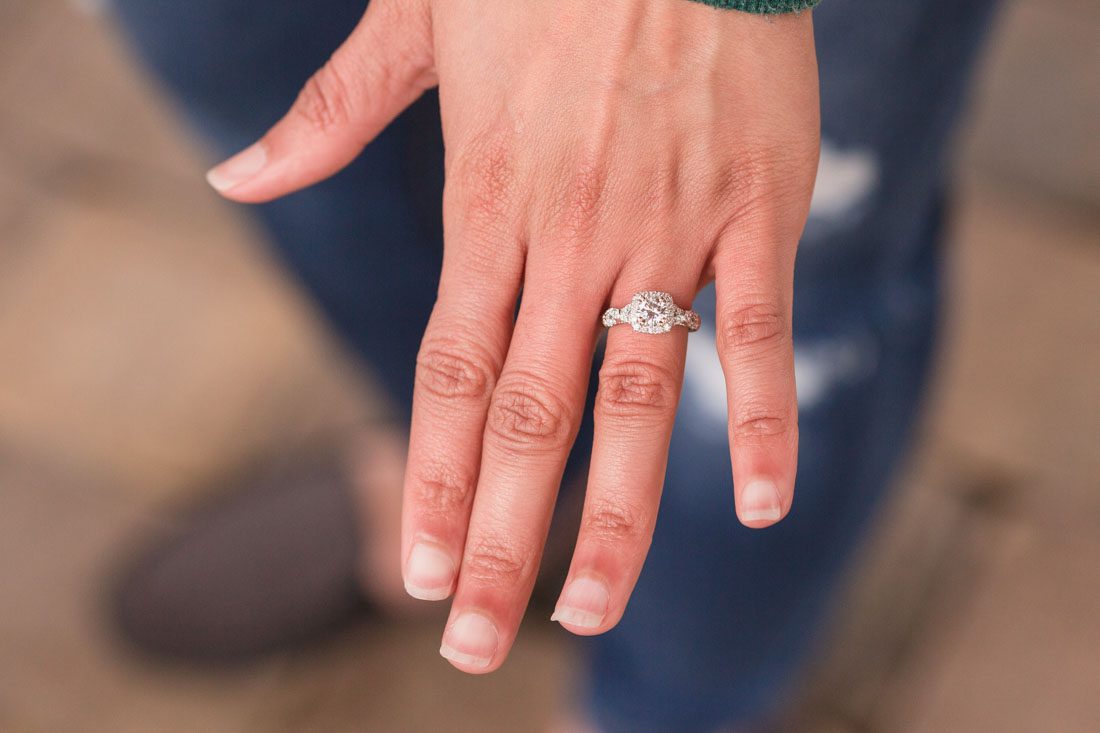 Bride shows off her new engagement ring captured by top Orlando engagement photographer