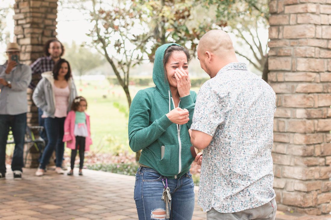 Surprise proposal in winter park captured by top Orlando wedding and engagement photographer