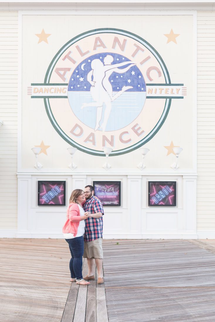 Couple dancing at Disney Boardwalk for their engagement portrait session