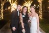 Orlando wedding photographer Elle poses with her clients who were married in Winter Garden