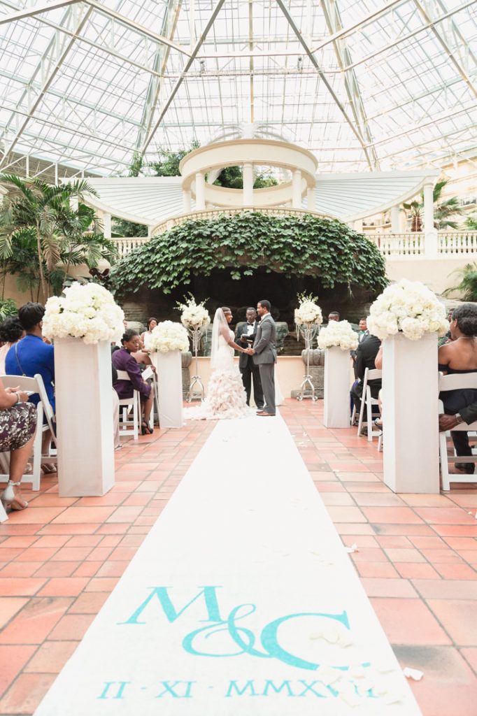 Wedding ceremony at the Gaylord Palms in Kissimmee by Orlando wedding photographer