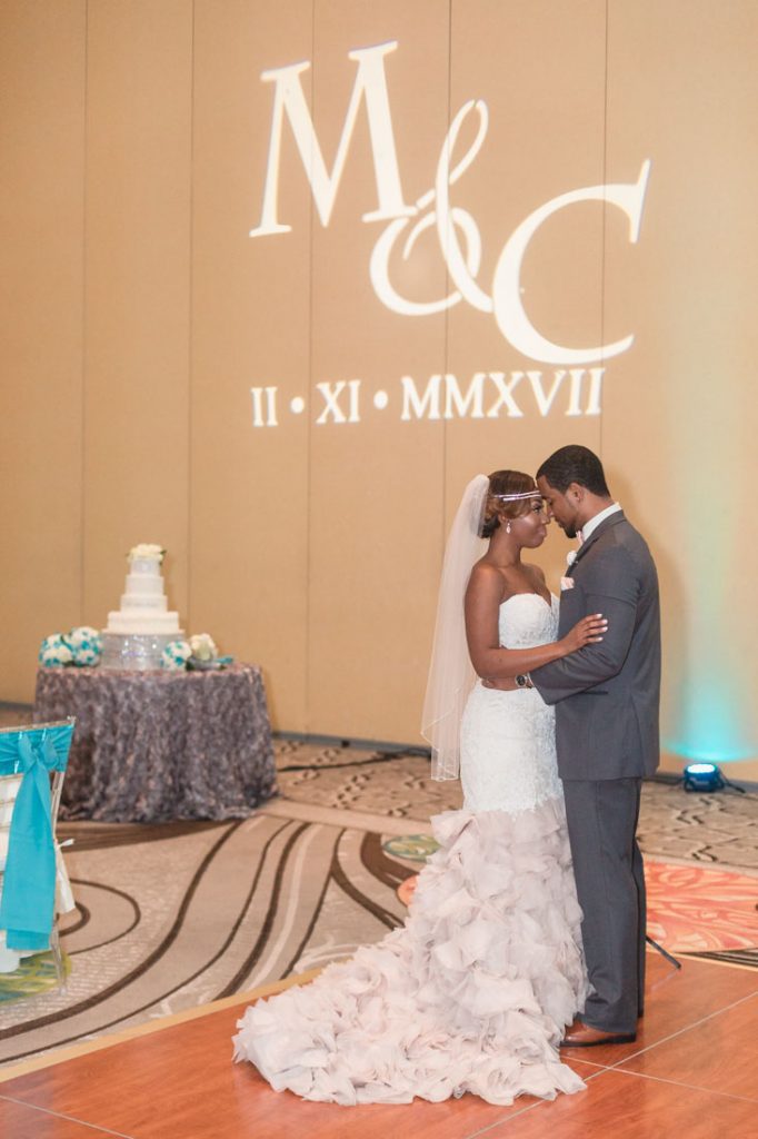 Bride and groom in their Tiffany blue reception room at the Gaylord Palms in Orlando, Florida