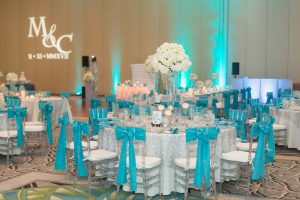 Glitz and glam sparkly Tiffany blue wedding reception at the Gaylord Palms by Orlando photographer