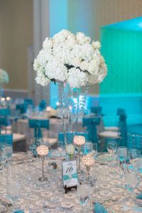 Glitz and glam sparkly Tiffany blue wedding reception at the Gaylord Palms by Orlando photographer