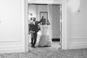 Bride and groom make their grand entrance into their wedding reception at the Gaylord Palms resort and convention center