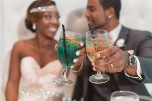 Newlyweds toast by Orlando wedding photographer at the Gaylord Palms in Kissimmee