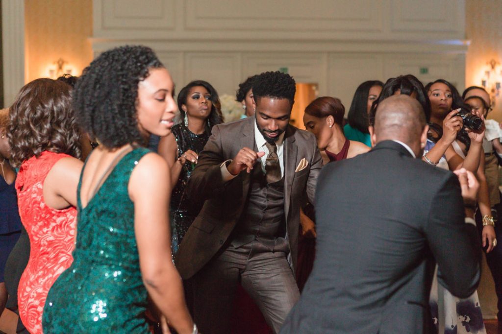 Guests dance and party at Gaylord Palms wedding reception captured by top Orlando wedding photographer