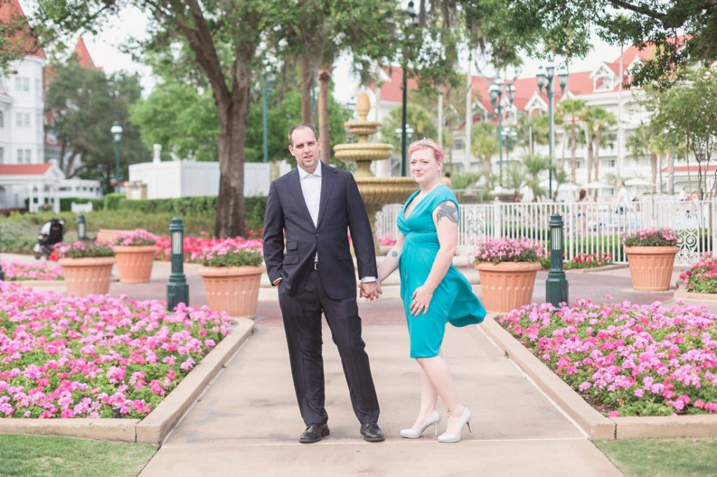 Engaged couple poses for candid and natural photos following a surprise Orlando proposal