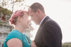 Sunset engagement photos at the Grand Floridian resort at Disney in Orlando, Florida by top wedding photographer