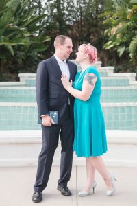 Newly engaged couple poses for engagement photo following a surprise proposal at Disney's Grand Floridian in Orlando
