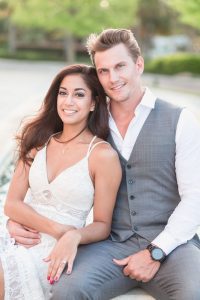 Sweet and romantic engagement portrait session in front of a fountain at Winter Garden City Hall by Orlando wedding photographer Captured by Elle