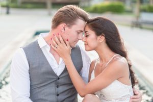 Sweet and romantic engagement portrait session in front of a fountain at Winter Garden City Hall by Orlando wedding photographer Captured by Elle