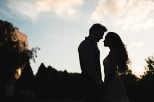 Unique silhouette of a couple during their sunset engagement photography session with top Orlando wedding photographer and videographer