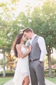 Engagement photos along a tree lined street in the charming historic town of Winter Garden, Florida captured by top Orlando wedding photographer