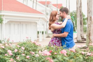 Romantic engagement session photo with roses at Disney's Grand Floridian Resort captured by Central Florida photographer