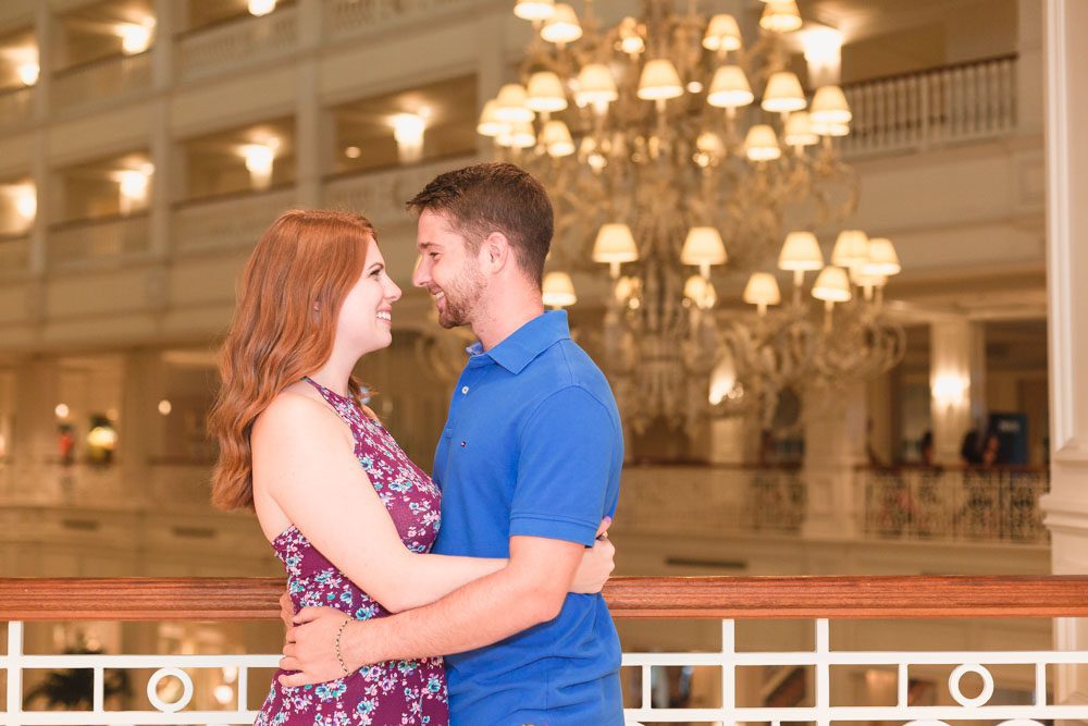 Engagement photography session at the Grand Floridian hotel featuring the beautiful chandelier captured by top Orlando photographer
