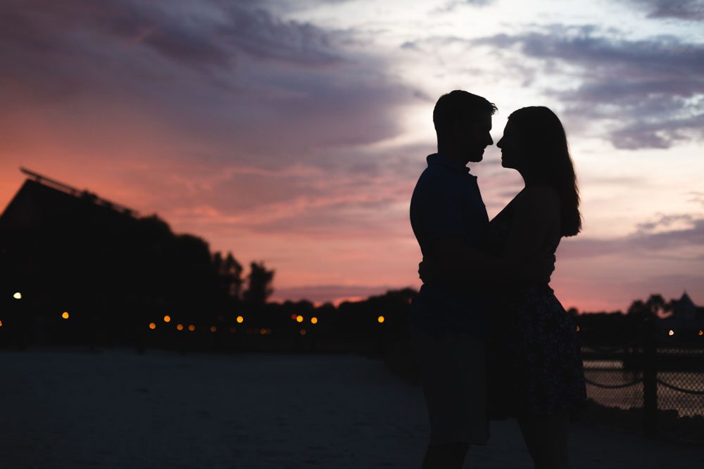 Romantic silhouette taken at Disney resort during an engagement photography session captured by top Central Florida wedding photographer 