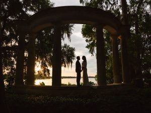 Silhouette of two brides at LGBT wedding captured by top Orlando photographer and videographer